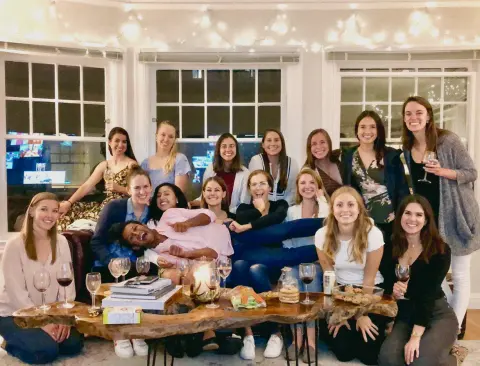 Rafat with friends at a Ladies' Wine Night in his SF apartment
